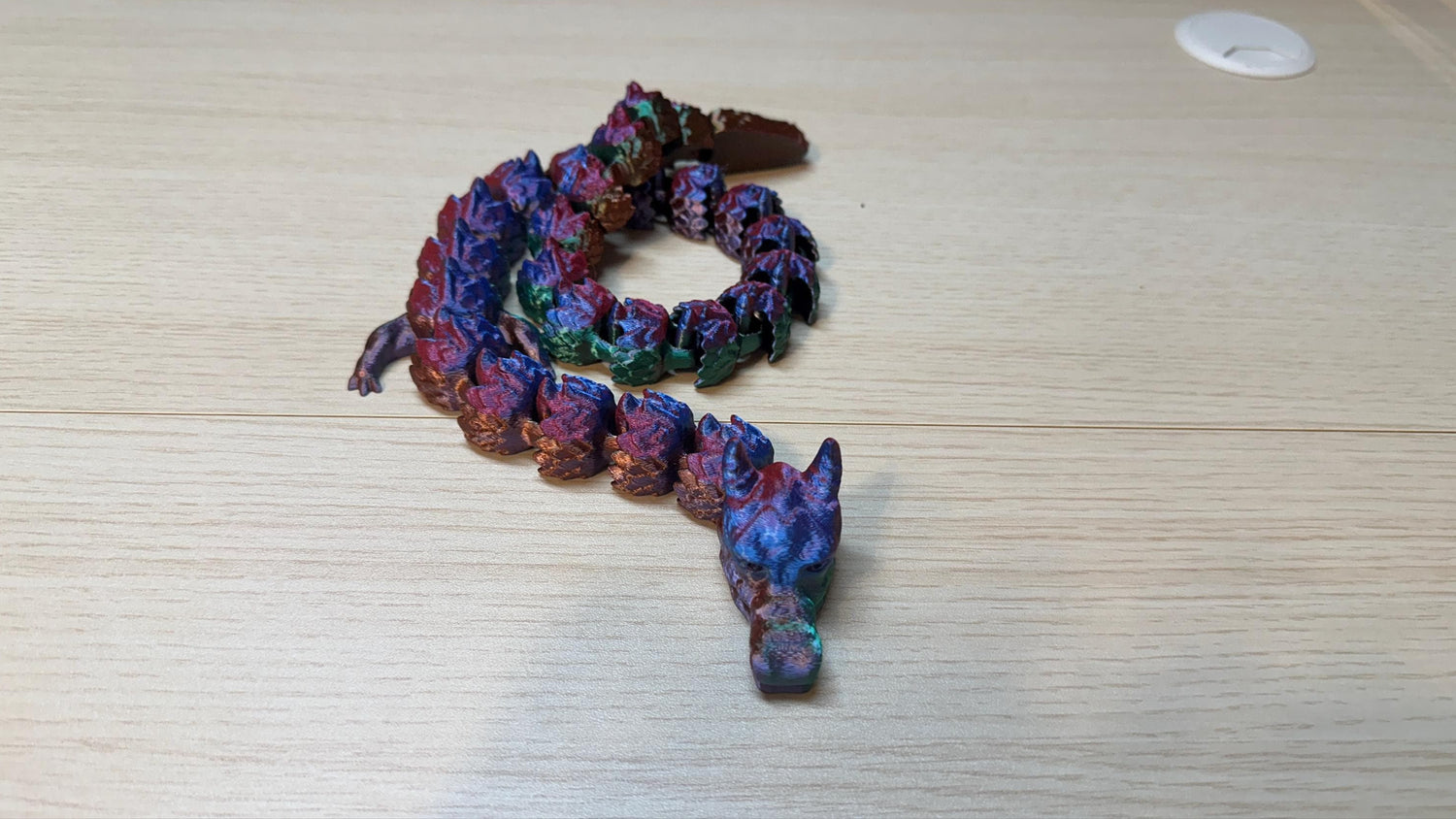 a 3d printed dragon that is multiple colors